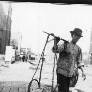 A man carrying yoke and baskets